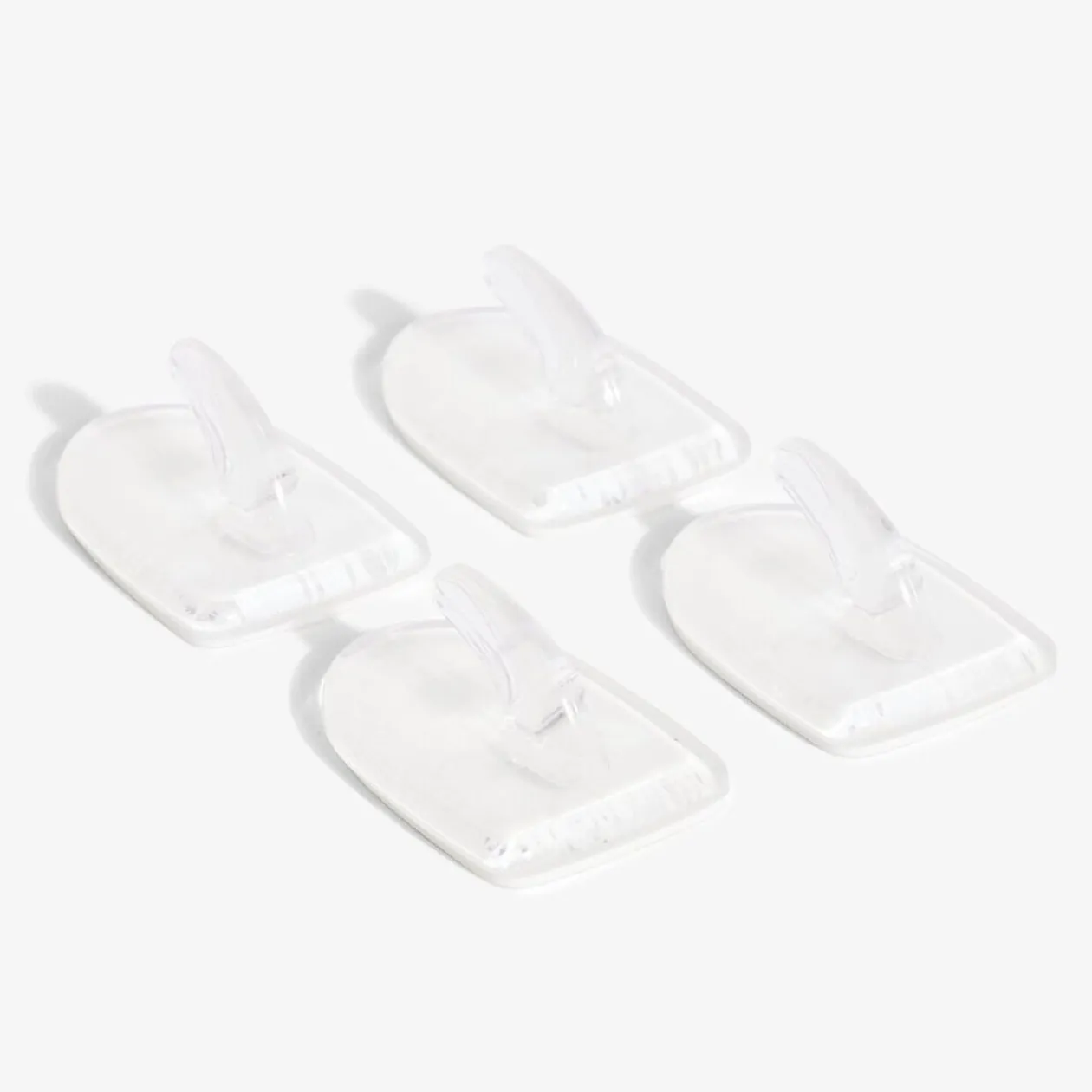 4 crochets adhésifs en plastique transparent - 25x35 mm