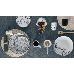 Assiette ronde blanche décor tiges feuilles noires