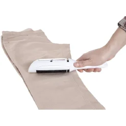 Brosse textile à réservoir